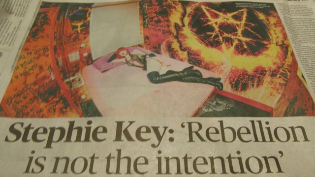 Bedroom in Hell: Cherry Lazar posed with an occult firey pentacle symbol.